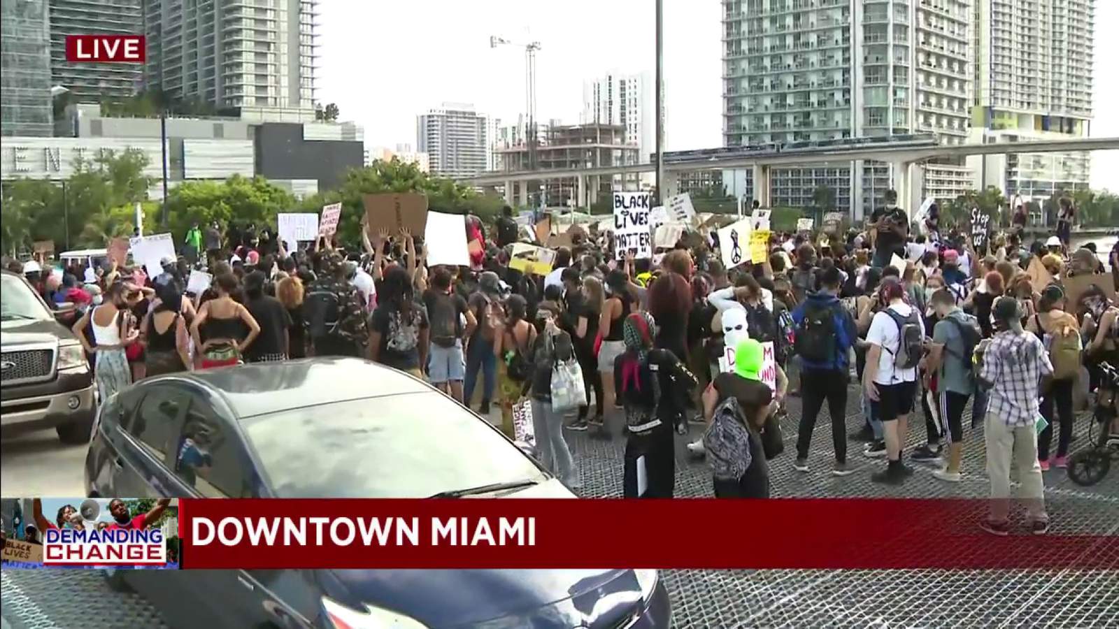 Protesters march near Miami's Brickell City Center