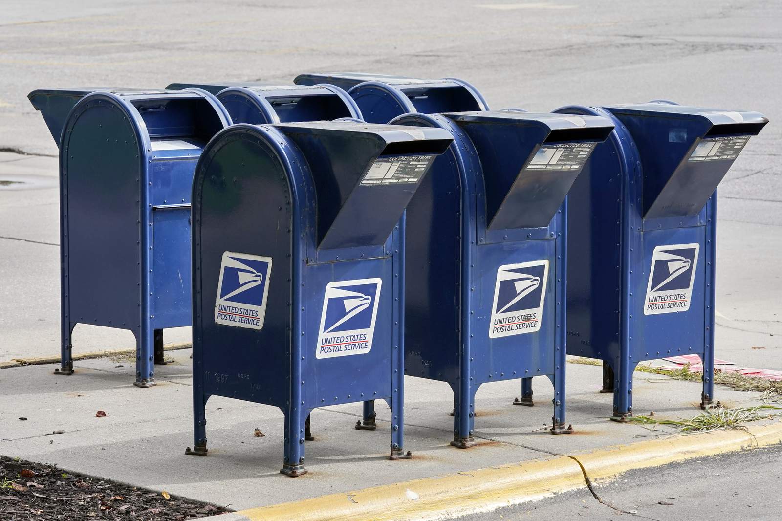 Postal Service halts some changes amid outcry, lawsuits