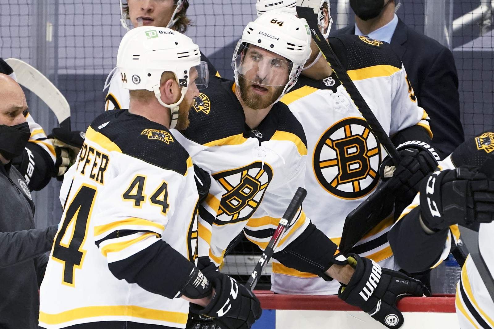 The Latest: NHL's Bruins resume practice, scheduled to play