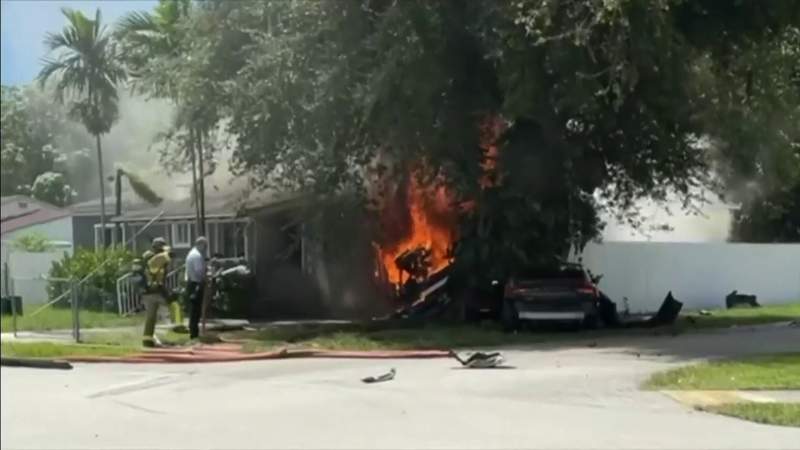 Car crash sets house on fire in Miami-Dade, injures 2