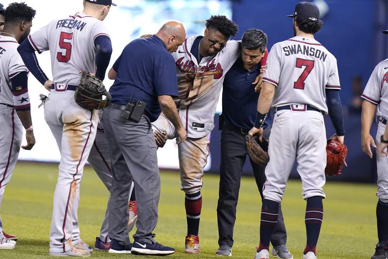 Braves star Acuña out for season after tearing knee in game