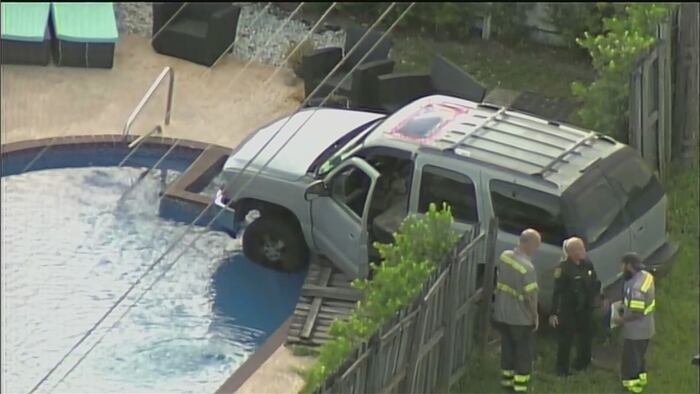 SUV crashes into fence of home in Dania Beach, nearly lands in pool