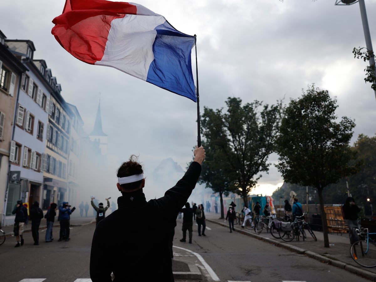 Mass protests challenge Macron as French police use tear gas and water cannons