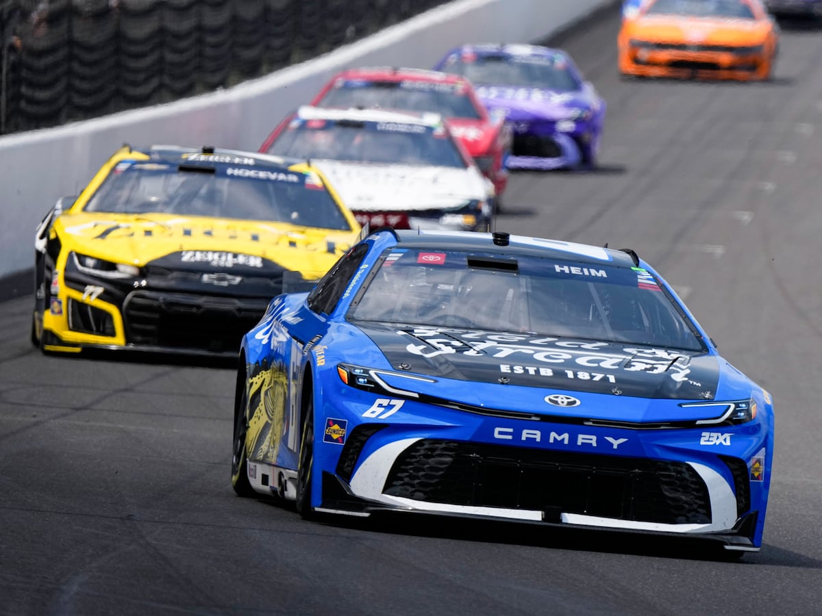 Image linked from the original feed: Corey Heim executes daring pass on final restart and holds on for historic Brickyard 400 victory