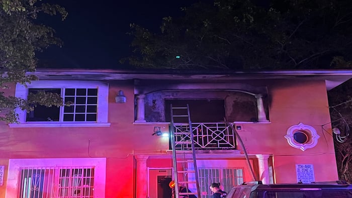 Elderly woman rescued from balcony after fire erupts inside Miami duplex