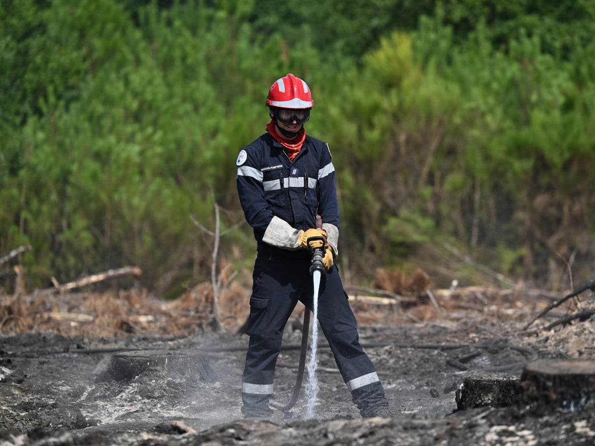 Image linked from the original feed: Firefighters battle the last hot spots of a monster wildfire in France's southwest