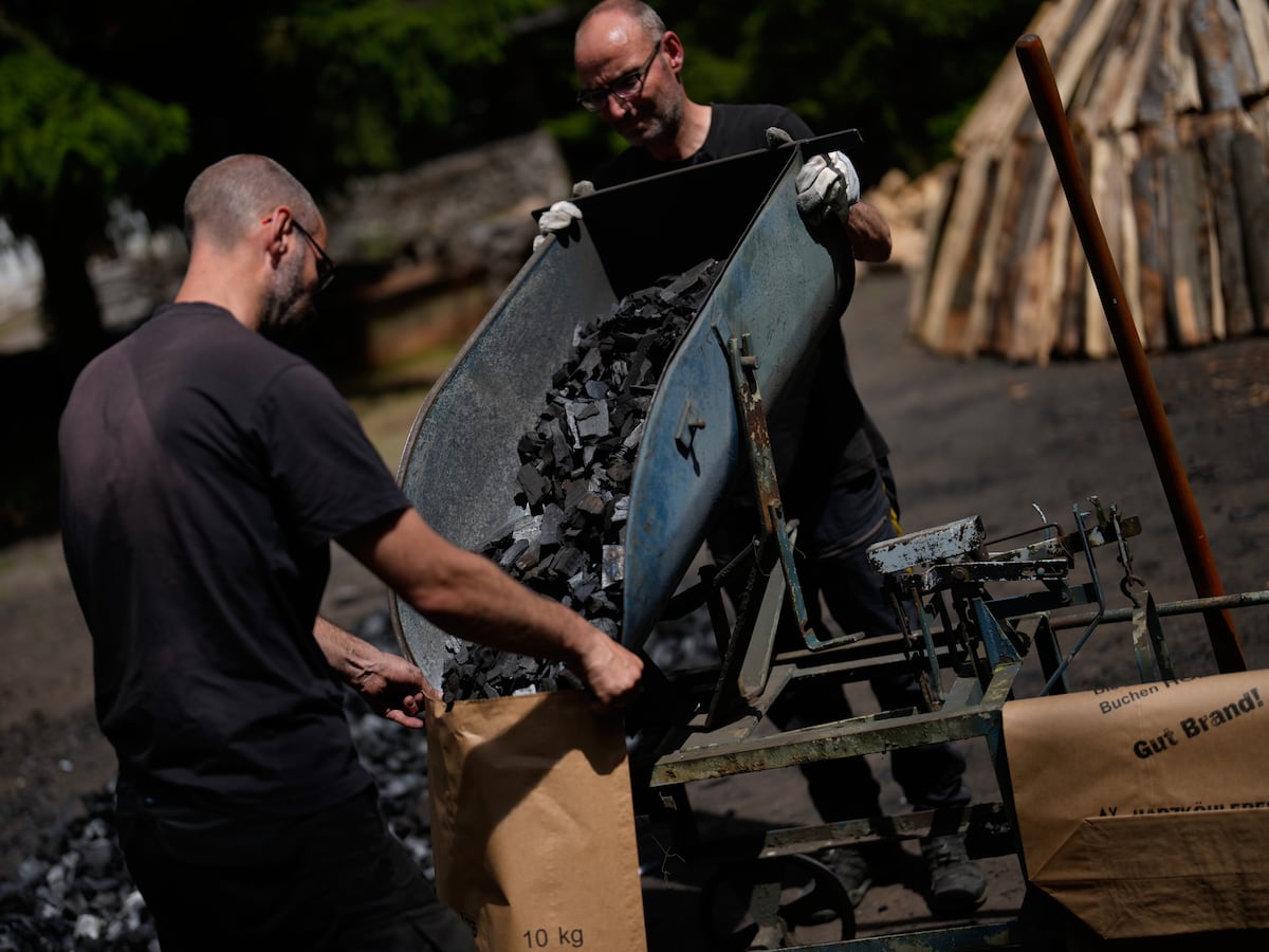 Image linked from the original feed: In a German forest, 2 brothers keep the ancient tradition of charcoal burning alive