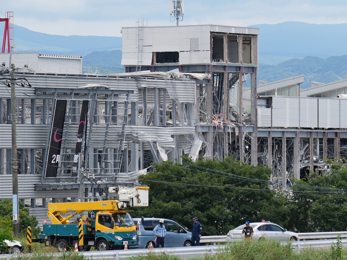 Image linked from the original feed: Rescuers search for the missing after Japan earthquake as death toll rises to 13