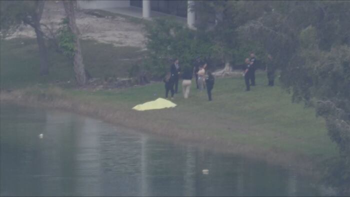 Police: Man found dead in canal near offices in Doral