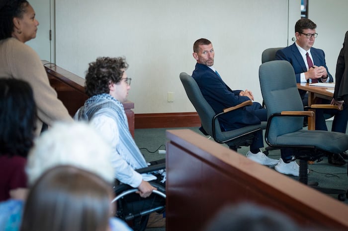 Jason Eaton watches as Hisham Awartani arrives to testify in Eaton's trial in Burlington, Vt., Monday, Sept. 14, 2026. (Glenn Russell/Pool photo via AP) (Glenn Russell) (Glenn Russell/Glenn Russell/VTDigger via AP)