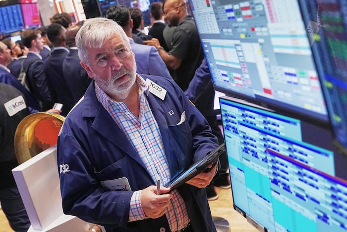 Wall Street holds steadier as chip companies swing back upward