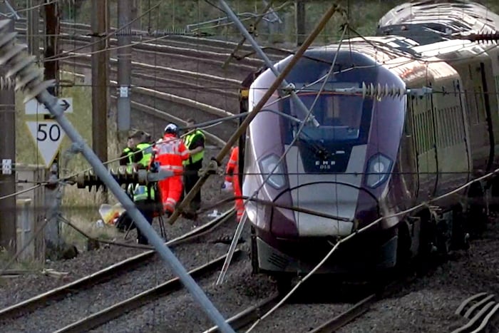 Two trains collide north of London, killing at least 1 person and injuring dozens
