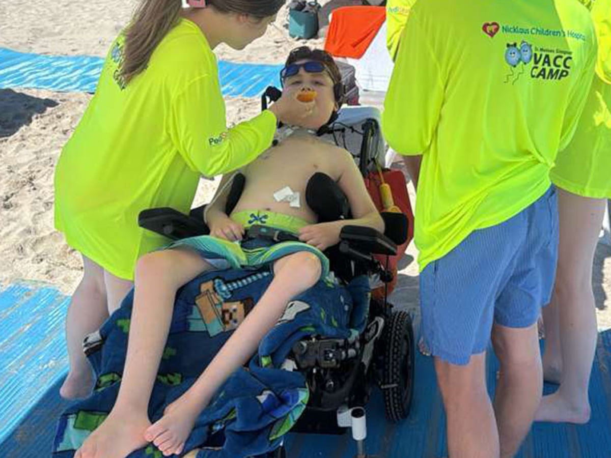Dr. Moises Simpser VACC Camp participants have fun on the beach on Tuesday in Miami Beach.