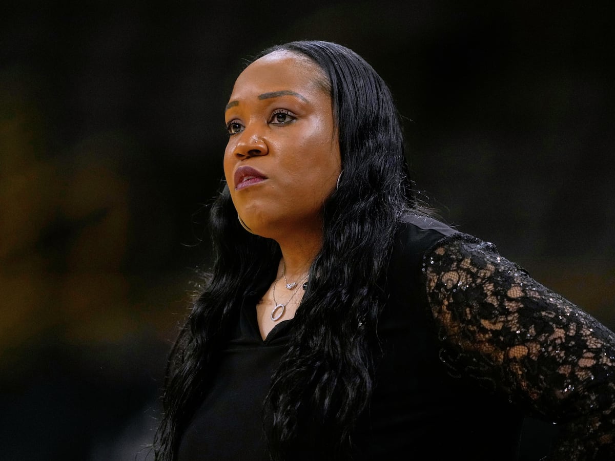 Image linked from the original feed: Virginia and coach Amaka Agugua-Hamilton reach a settlement after her sudden dismissal