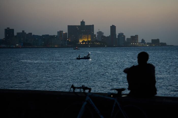 Cubans sleep on seaside boardwalk to seek relief from crippling blackouts and summer heat