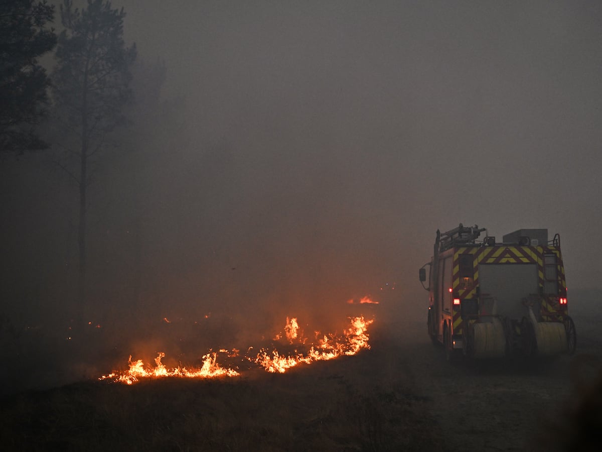 Image linked from the original feed: Macron calls crisis meeting as monster wildfires drive 250,000 from their homes