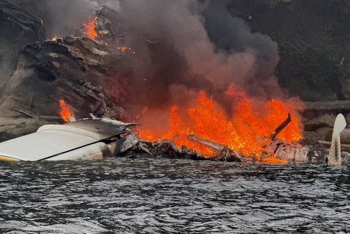 A float plane changed course to avoid a storm before crashing on a Washington island, injuring 11