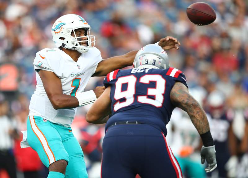 Tua’s TD pass, turnover by Howard lift Dolphins over Pats