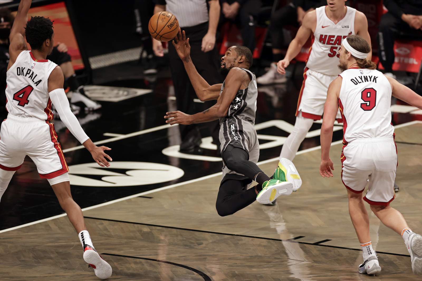 Harden, Durant help Nets break away late, beat Heat 98-85