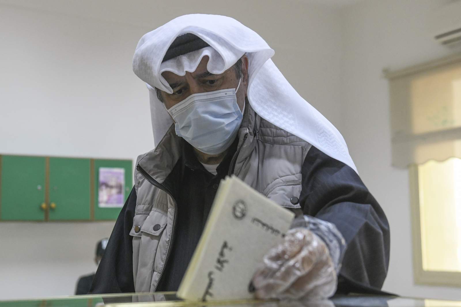 Kuwait votes for parliament amid economic, virus challenges